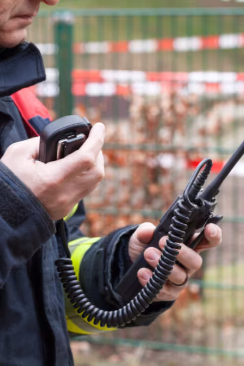 ERRCS system with emergency responder holding radio