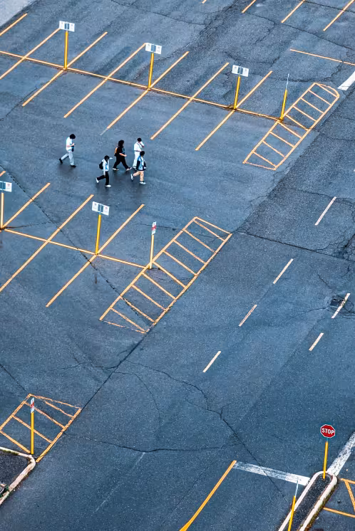 Parking lot with people walking