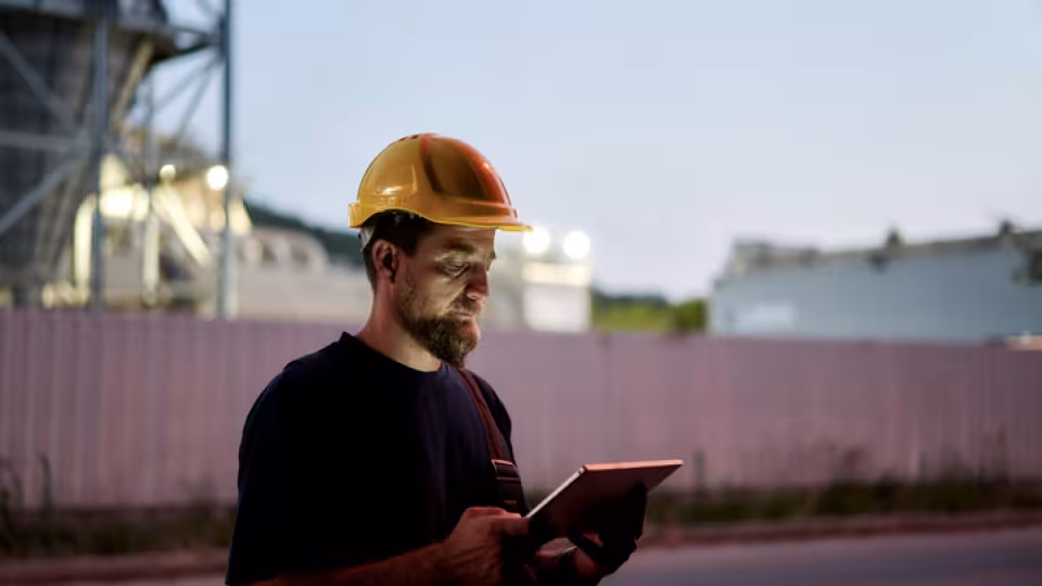 Construction worker on tablet