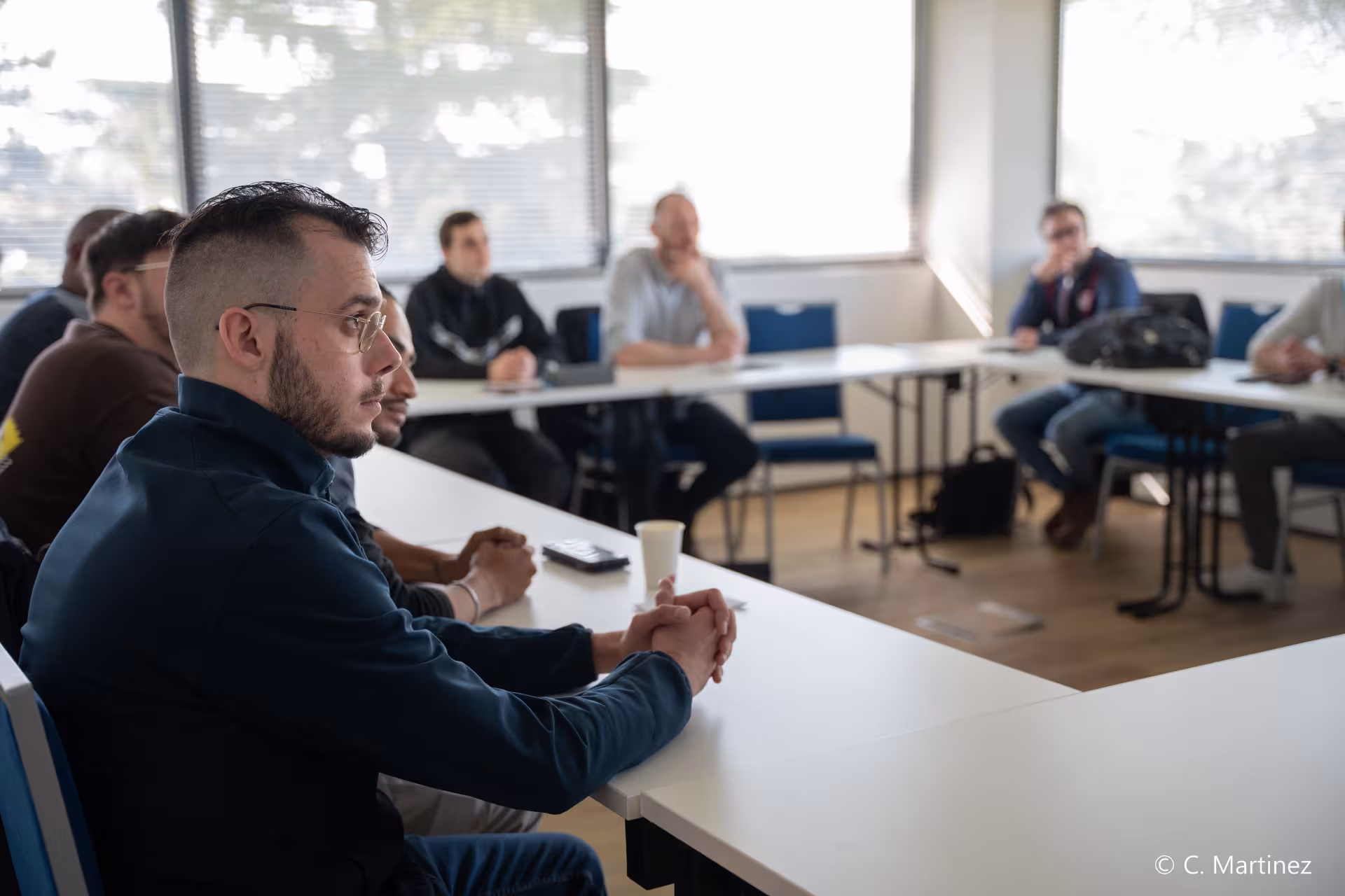 Des utilisateurs concentrées pendant la formation PTI-DATI